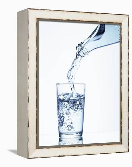 Pouring Water from a Bottle into a Glass-Petr Gross-Framed Premier Image Canvas