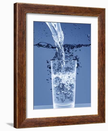 Pouring Water from a Bottle into a Glass-Petr Gross-Framed Photographic Print