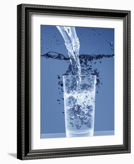 Pouring Water from a Bottle into a Glass-Petr Gross-Framed Photographic Print