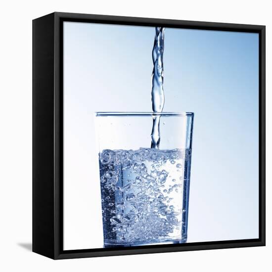 Pouring Water into a Glass-Kai Schwabe-Framed Premier Image Canvas