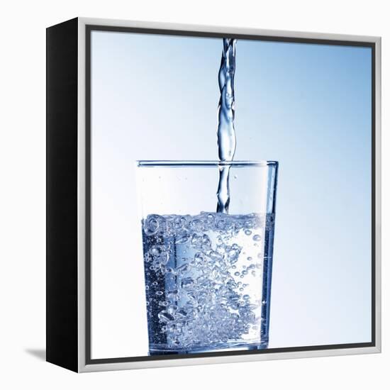 Pouring Water into a Glass-Kai Schwabe-Framed Premier Image Canvas