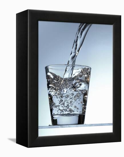 Pouring Water into a Glass-Bodo A^ Schieren-Framed Premier Image Canvas