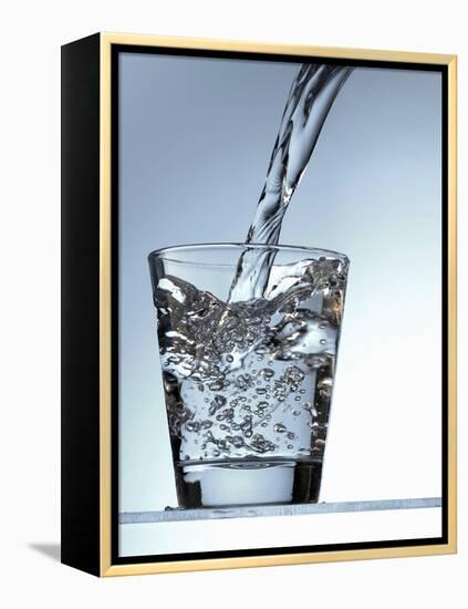 Pouring Water into a Glass-Bodo A^ Schieren-Framed Premier Image Canvas