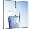 Pouring Water into a Glass-Kai Schwabe-Mounted Photographic Print