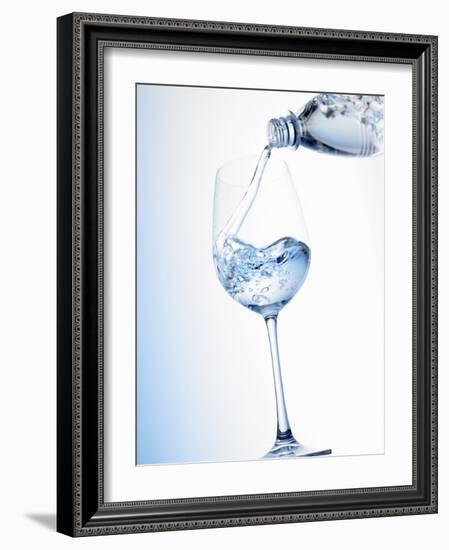 Pouring Water into a Glass-Klaus Arras-Framed Photographic Print