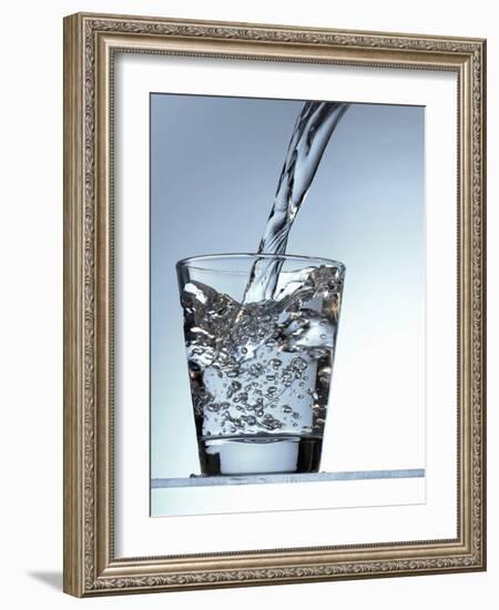 Pouring Water into a Glass-Bodo A^ Schieren-Framed Photographic Print