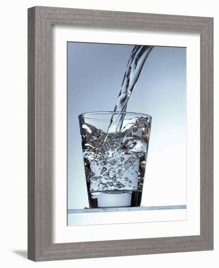 Pouring Water into a Glass-Bodo A^ Schieren-Framed Photographic Print