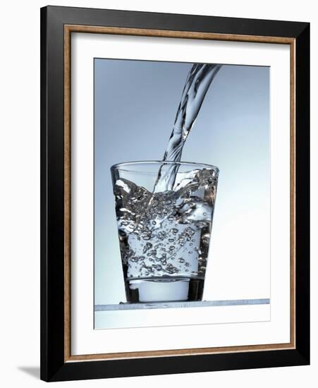 Pouring Water into a Glass-Bodo A^ Schieren-Framed Photographic Print