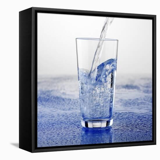 Pouring Water into Glass-Alexander Feig-Framed Premier Image Canvas