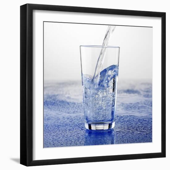 Pouring Water into Glass-Alexander Feig-Framed Photographic Print