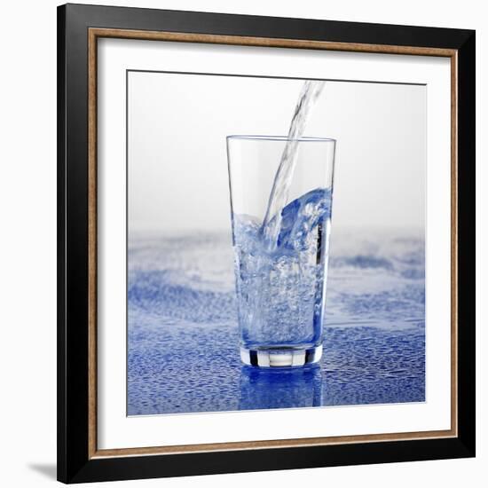 Pouring Water into Glass-Alexander Feig-Framed Photographic Print