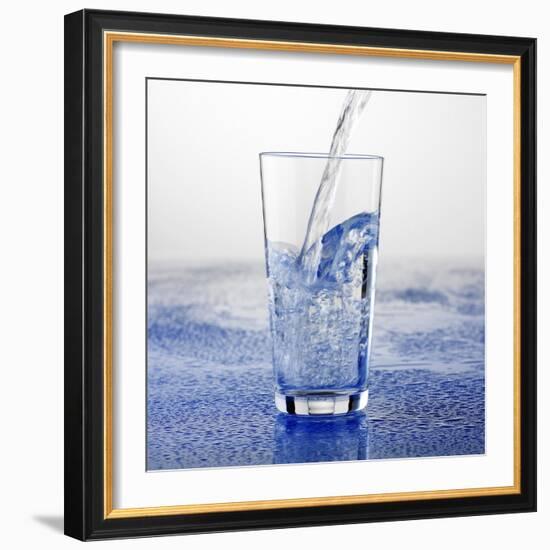 Pouring Water into Glass-Alexander Feig-Framed Photographic Print