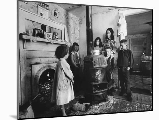 Poverty Stricken Family Huddling Around a Wood Stove in Their Home-John Dominis-Mounted Photographic Print