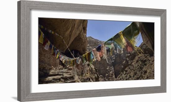 Prayer flags at the entrance of Chhungsi Cave, Mustang District, Gandaki Pradesh, Nepal-Panoramic Images-Framed Photographic Print