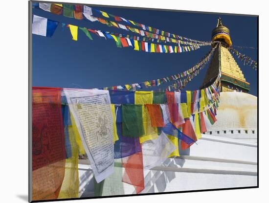 Prayer Flags Flutter from the Apex of Bodnath Stupa, Kathmandu, Nepal-Christopher Bettencourt-Mounted Photographic Print