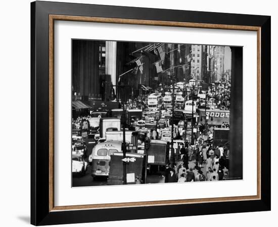 Pre-Christmas Holiday Traffic on 57th Avenue, Teeming with Double Decker Busses, Trucks and Cars-Andreas Feininger-Framed Photographic Print