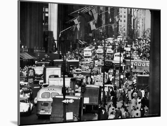 Pre-Christmas Holiday Traffic on 57th Avenue, Teeming with Double Decker Busses, Trucks and Cars-Andreas Feininger-Mounted Photographic Print