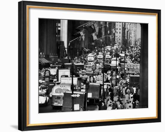 Pre-Christmas Holiday Traffic on 57th Avenue, Teeming with Double Decker Busses, Trucks and Cars-Andreas Feininger-Framed Photographic Print