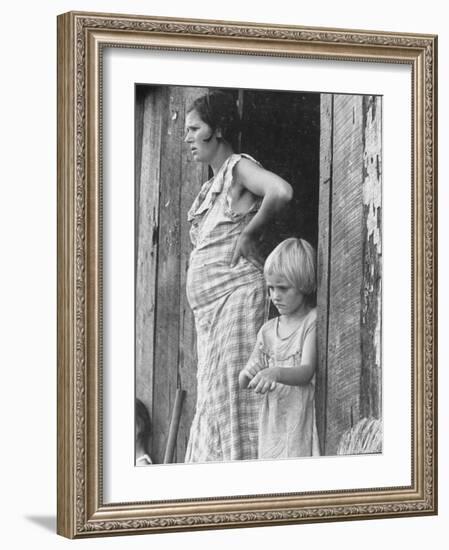 Pregnant Sharecropper's Wife Standing in Doorway of Wooden Shack with Daughter, the Depression-Arthur Rothstein-Framed Photographic Print