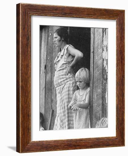 Pregnant Sharecropper's Wife Standing in Doorway of Wooden Shack with Daughter, the Depression-Arthur Rothstein-Framed Photographic Print