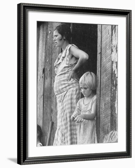 Pregnant Sharecropper's Wife Standing in Doorway of Wooden Shack with Daughter, the Depression-Arthur Rothstein-Framed Photographic Print