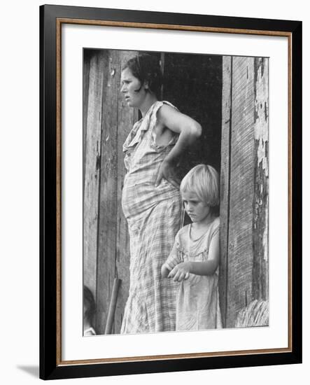 Pregnant Sharecropper's Wife Standing in Doorway of Wooden Shack with Daughter, the Depression-Arthur Rothstein-Framed Photographic Print