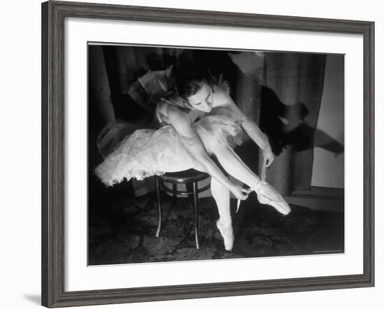 Premier Ballerina Semionova Tying Her Toe Shoe Before a Performance at the Great Theater-Margaret Bourke-White-Framed Photographic Print