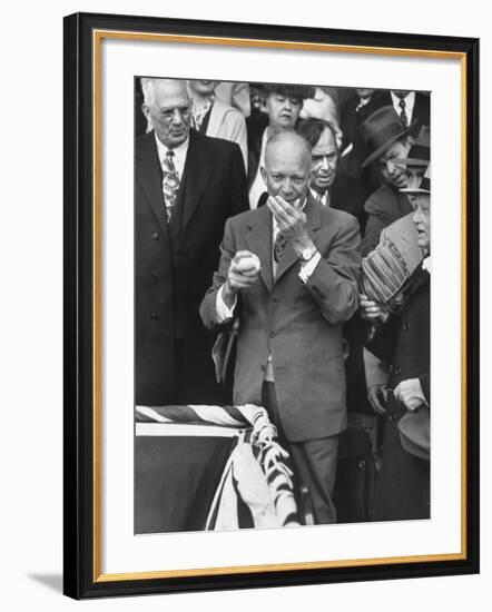 Pres. Dwight D. Eisenhower, Applying a Wet Whammy to First Official Baseball of Washington Season-George Skadding-Framed Photographic Print