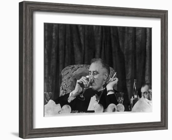 Pres. Franklin Roosevelt Drinking Wine and Smoking a Cigarette During the Jackson Day Dinner-null-Framed Photographic Print