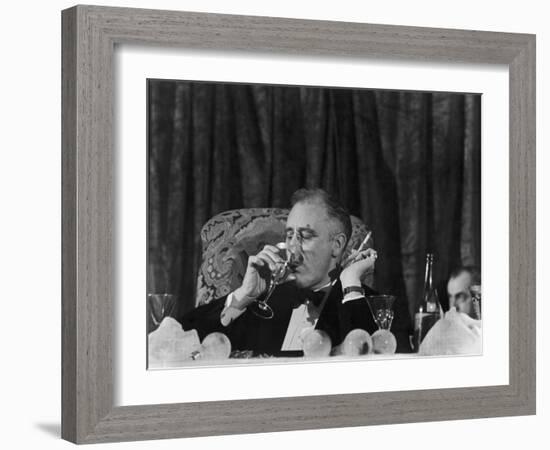 Pres. Franklin Roosevelt Drinking Wine and Smoking a Cigarette During the Jackson Day Dinner-null-Framed Photographic Print