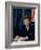 Pres. John F. Kennedy Sitting at His Desk, with Flag in Bkgrd-Alfred Eisenstaedt-Framed Photographic Print