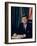 Pres. John F. Kennedy Sitting at His Desk, with Flag in Bkgrd-Alfred Eisenstaedt-Framed Photographic Print