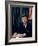 Pres. John F. Kennedy Sitting at His Desk, with Flag in Bkgrd-Alfred Eisenstaedt-Framed Photographic Print