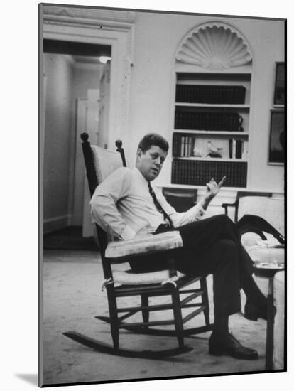 Pres. John F. Kennedy Sitting in Rocking Chair-null-Mounted Photographic Print