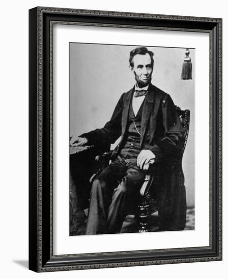 President Abraham Lincoln Sitting in a Chair-null-Framed Photographic Print