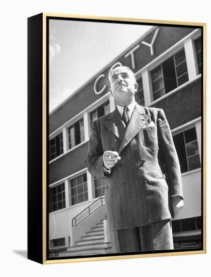 President and Director of Coty Perfumes Andre Lavault in Front of Building Holding Cigarette-Hans Wild-Framed Premier Image Canvas