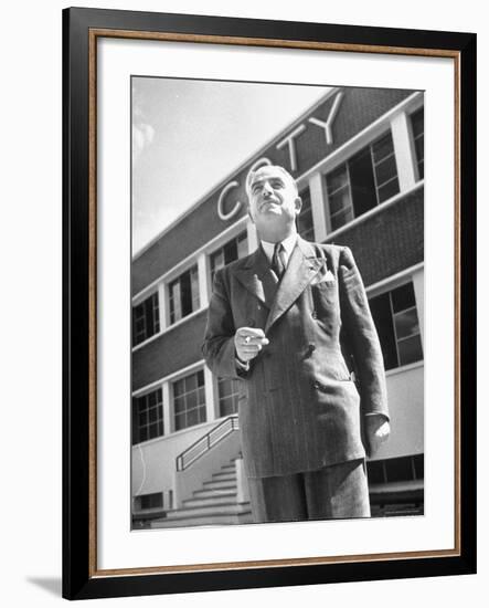 President and Director of Coty Perfumes Andre Lavault in Front of Building Holding Cigarette-Hans Wild-Framed Premium Photographic Print