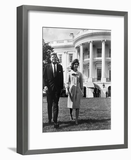 President and Mrs. John F. Kennedy Walking on the South Lawn of the White House on April 16, 1962-null-Framed Photo