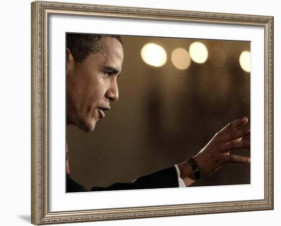 President Barack Obama Answers a Question During His First Prime Time Televised News Conference-null-Framed Photographic Print