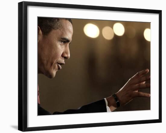 President Barack Obama Answers a Question During His First Prime Time Televised News Conference-null-Framed Photographic Print