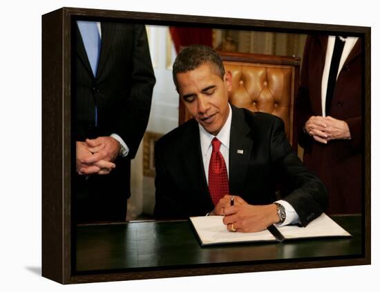 President Barack Obama Signs His First Act as President in the President's Room, January 20, 2009-null-Framed Premier Image Canvas