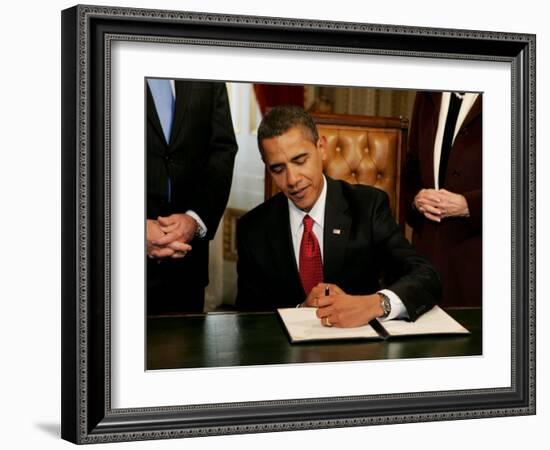 President Barack Obama Signs His First Act as President in the President's Room, January 20, 2009-null-Framed Photographic Print