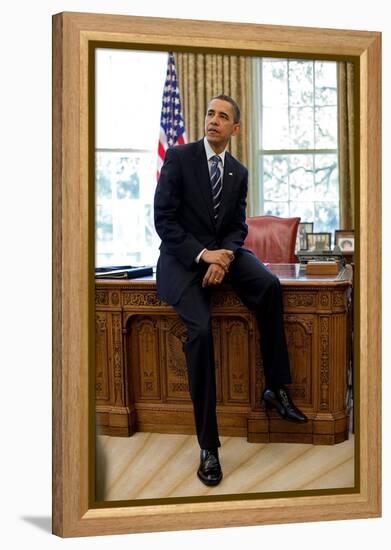 President Barack Obama Sits on the Edge of the Resolute Desk in the Oval Office, April 30, 2010-null-Framed Stretched Canvas