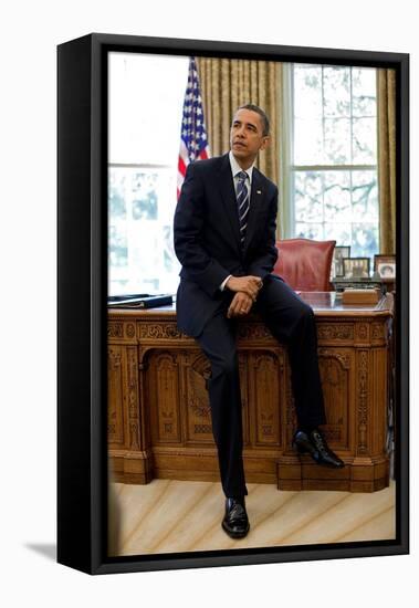 President Barack Obama Sits on the Edge of the Resolute Desk in the Oval Office, April 30, 2010-null-Framed Stretched Canvas