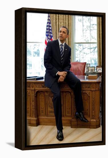 President Barack Obama Sits on the Edge of the Resolute Desk in the Oval Office, April 30, 2010-null-Framed Stretched Canvas