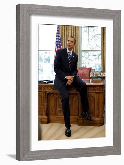 President Barack Obama Sits on the Edge of the Resolute Desk in the Oval Office, April 30, 2010-null-Framed Photo