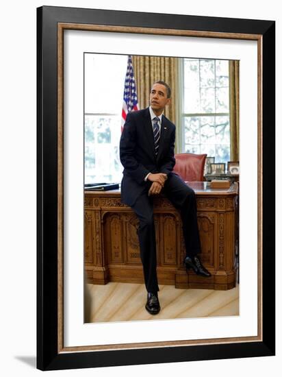 President Barack Obama Sits on the Edge of the Resolute Desk in the Oval Office, April 30, 2010-null-Framed Photo