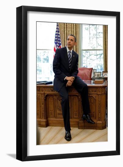 President Barack Obama Sits on the Edge of the Resolute Desk in the Oval Office, April 30, 2010-null-Framed Photo