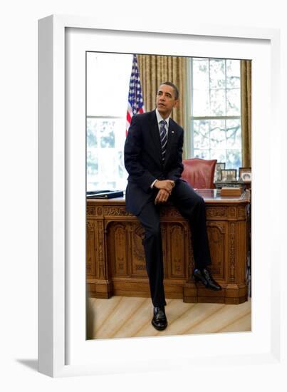 President Barack Obama Sits on the Edge of the Resolute Desk in the Oval Office, April 30, 2010-null-Framed Photo