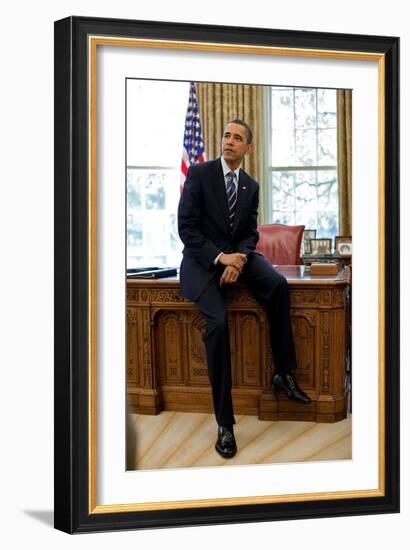 President Barack Obama Sits on the Edge of the Resolute Desk in the Oval Office, April 30, 2010-null-Framed Photo